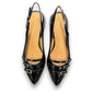 DJANGO & JULIETTE Eshano black patent leather slingback flat with triple buckle detail and low heel. 
top view.