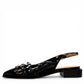 DJANGO & JULIETTE Eshano black patent leather slingback flat with triple buckle detail and low heel. 
left view.
