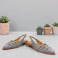 DJANGO & JULIETTE Eshano denim blue patent leather slingback flat with triple buckle detail and low heel. front view