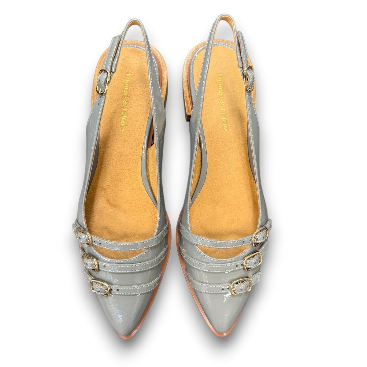 DJANGO & JULIETTE Eshano denim blue patent leather slingback flat with triple buckle detail and low heel. top view.