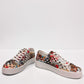Django & Juliette Leithah leather sneakers featuring a colorful collage print and white platform sole. front view.