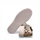 Django & Juliette Leithah metallic gold leather sneakers with heart-shaped cutouts and side zippers. bottom view.