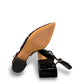 Django & Juliette navy patent leather slingback loafers with a 2-inch block heel and adjustable strap.
bottom view.
