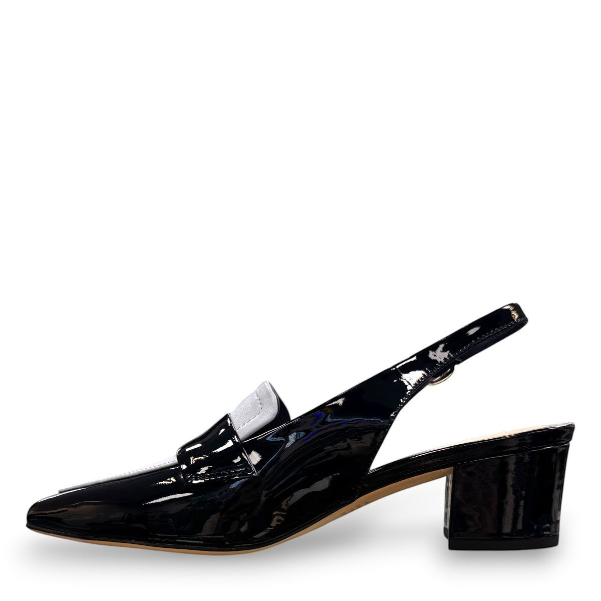 Django & Juliette navy patent leather slingback loafers with a 2-inch block heel and adjustable strap.
left view.
