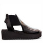 Django & Juliette Ozie black leather wedge sandal with elastic straps and a 2-inch platform sole. right view.