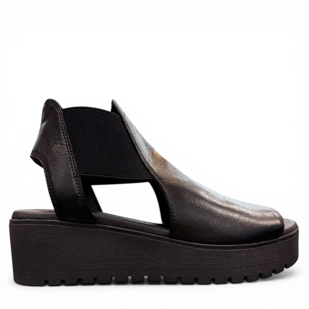 Django & Juliette Ozie black leather wedge sandal with elastic straps and a 2-inch platform sole. right view.