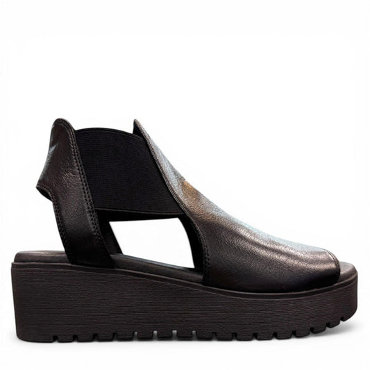 Django & Juliette Ozie black leather wedge sandal with elastic straps and a 2-inch platform sole. right view.