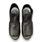 Django & Juliette Ozie black leather wedge sandal with elastic straps and a 2-inch platform sole. top view.