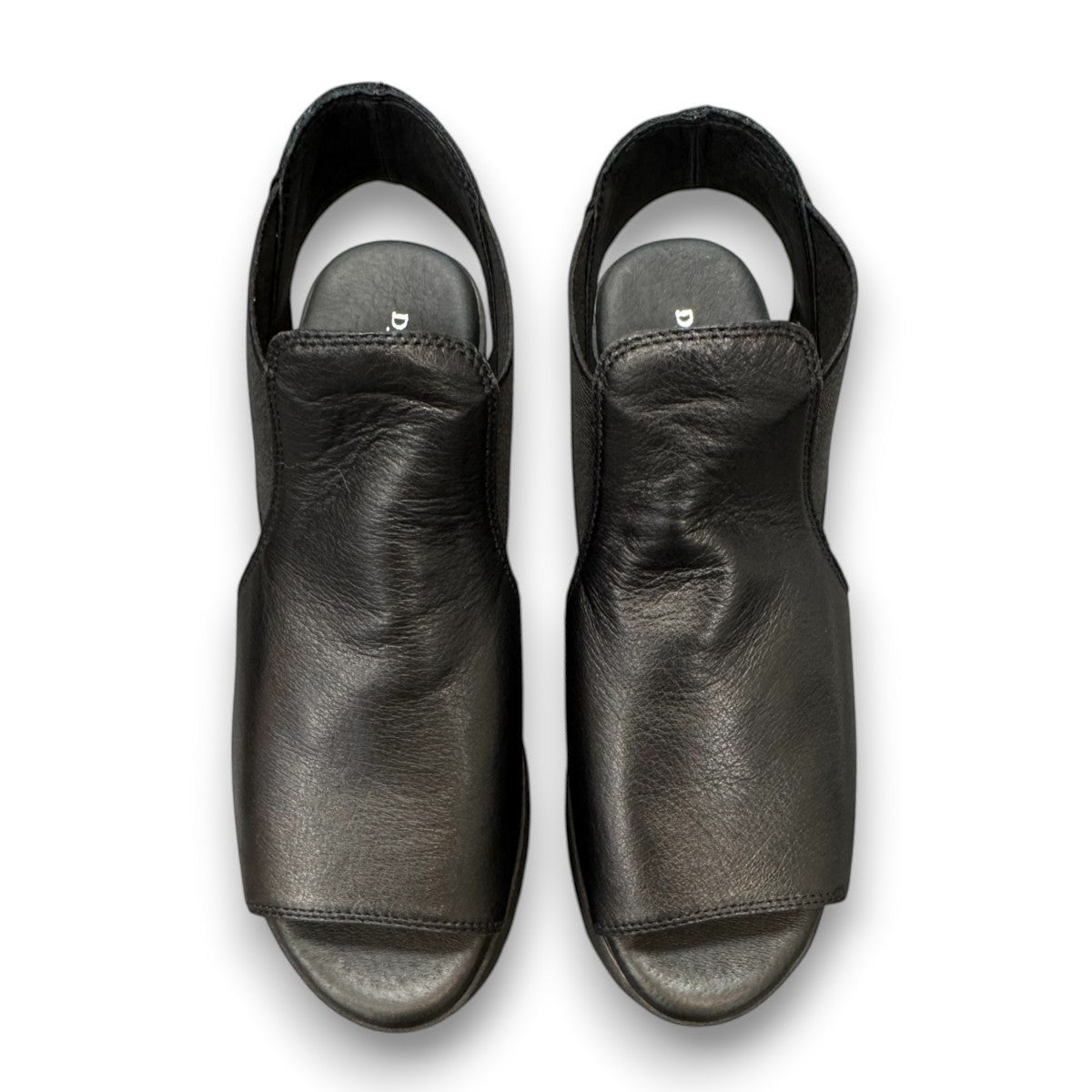 Django & Juliette Ozie black leather wedge sandal with elastic straps and a 2-inch platform sole. top view.