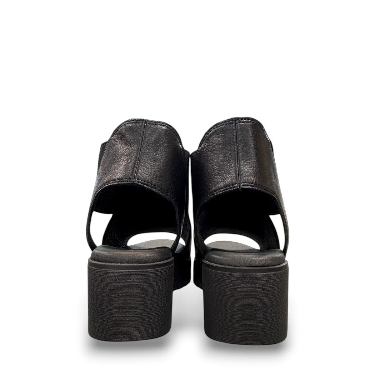 Django & Juliette Ozie black leather wedge sandal with elastic straps and a 2-inch platform sole. back view.
