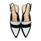 Django & Juliette navy patent leather slingback loafers with a 2-inch block heel and adjustable strap.
top view.