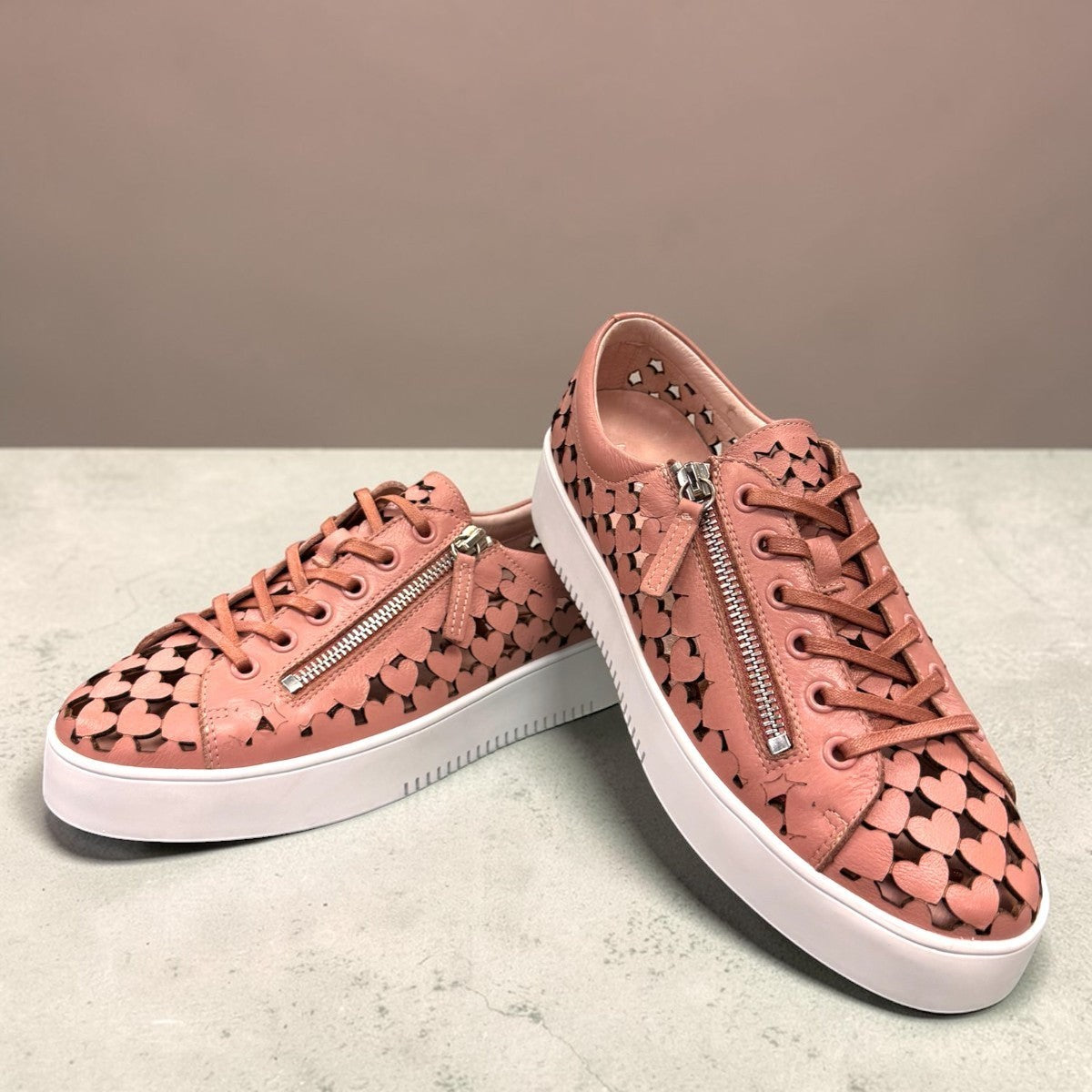 Django & Juliette Leithah sneaker in dark rose tumble leather with heart cutouts and white platform sole.