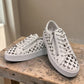 Django & Juliette white leather platform sneakers with heart-shaped laser cutouts and side zipper.front view.