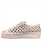 Django & Juliette white leather platform sneakers with heart-shaped laser cutouts and side zipper. left view.