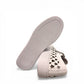 Django & Juliette white leather platform sneakers with heart-shaped laser cutouts and side zipper. bottom view.
