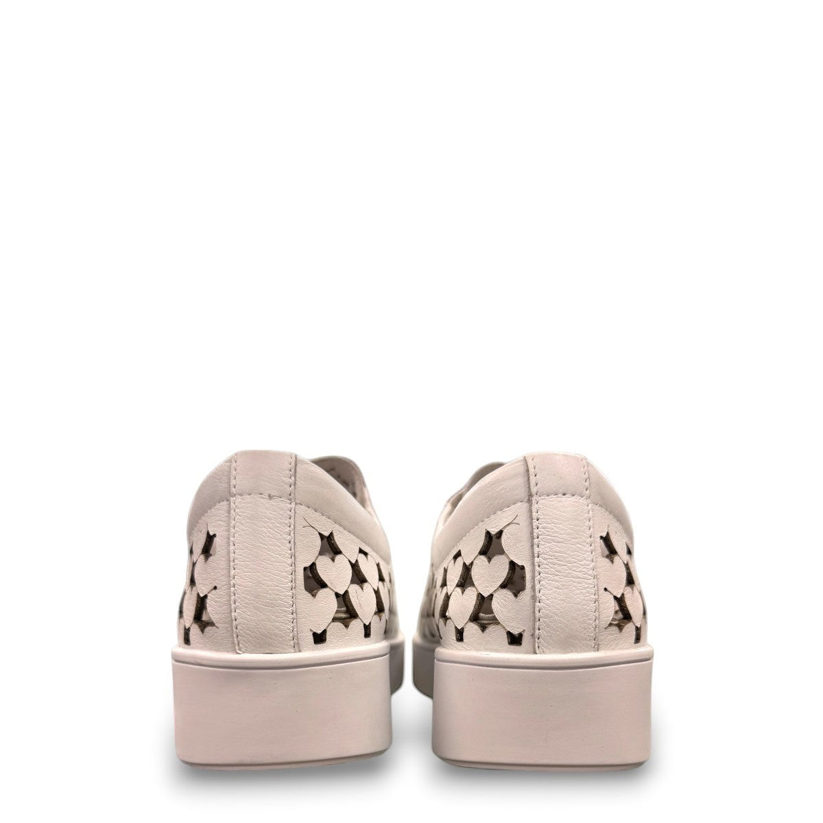 Django & Juliette white leather platform sneakers with heart-shaped laser cutouts and side zipper. back view.
