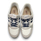 Drew Connor white combo suede casual shoe showing the slip-resistant rubber outsole and rocker bottom.
