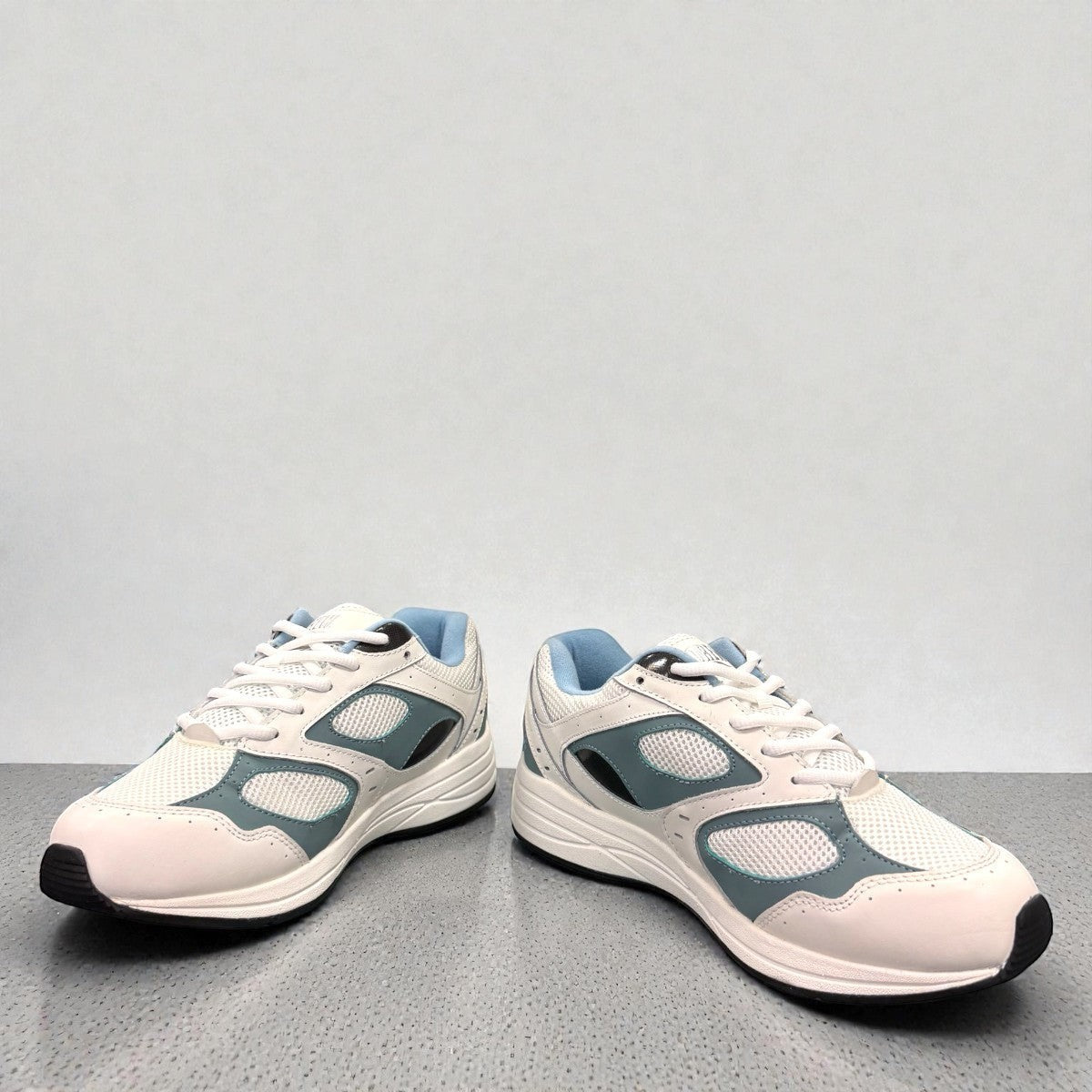 Drew Flare athletic shoes in white and blue with a durable rubber rocker bottom outsole. orthopedic shoe