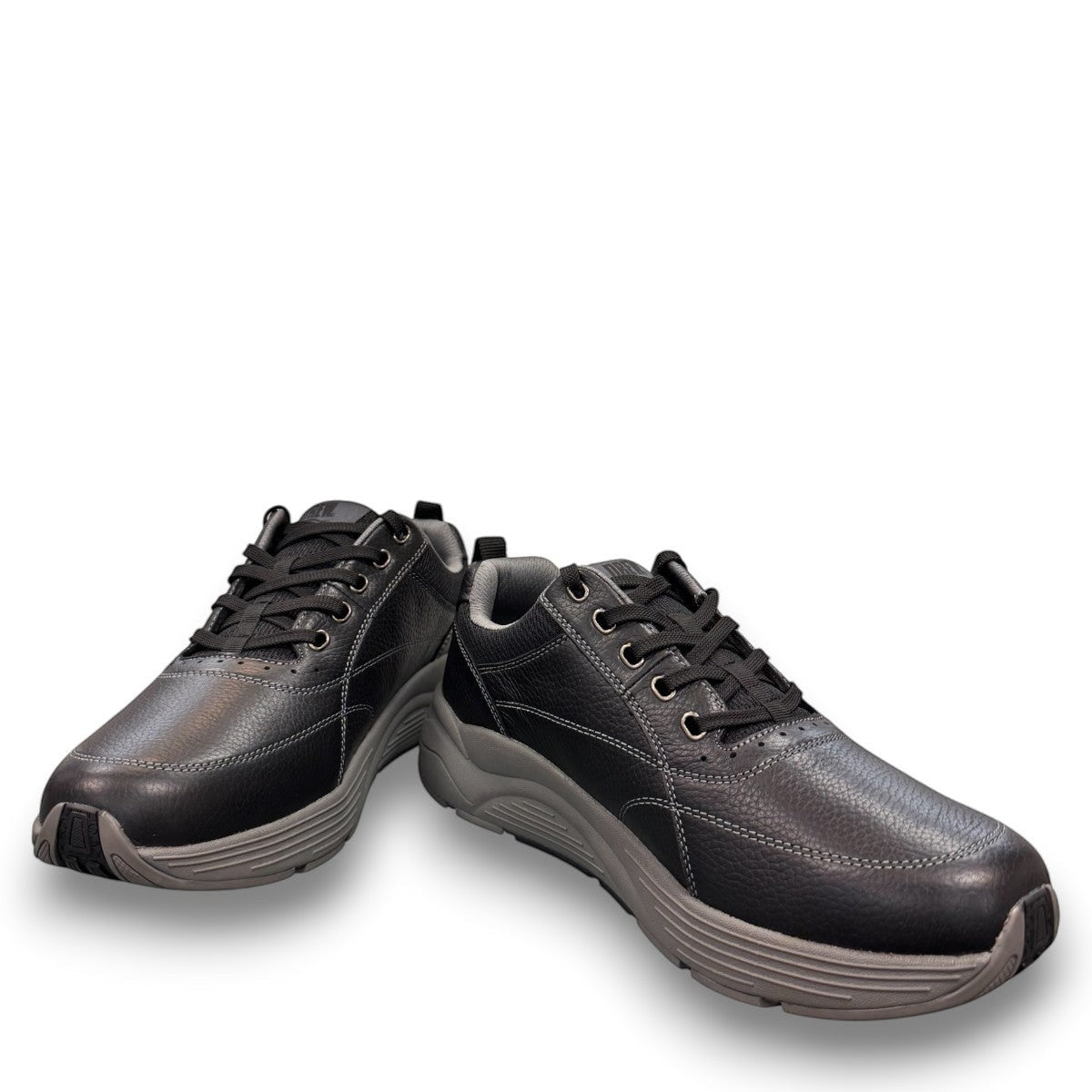 Drew Maker black pebbled leather casual shoe showing the slip-resistant rubber rocker bottom outsole