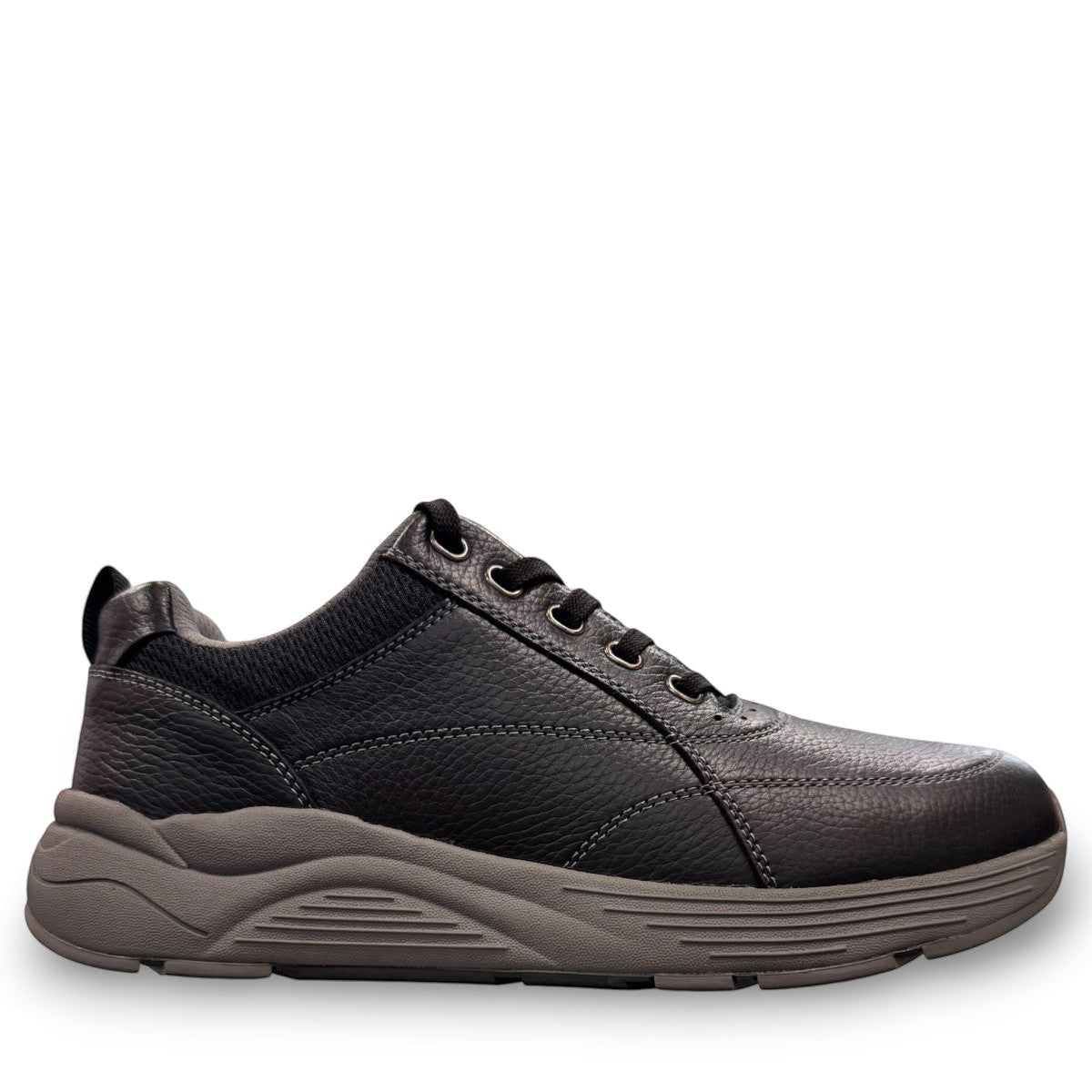 Drew Maker black pebbled leather casual shoe showing the slip-resistant rubber rocker bottom outsole