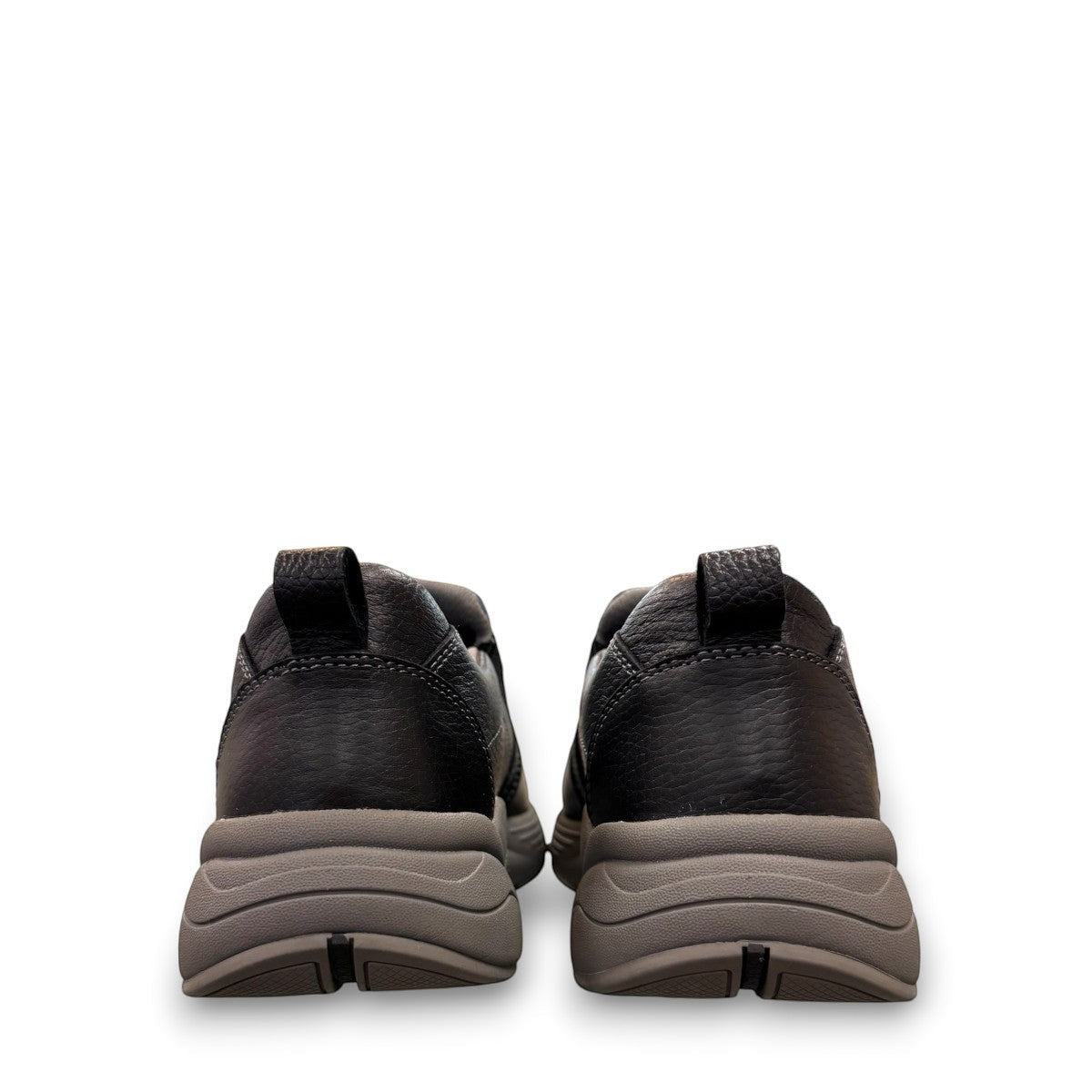 Drew Match black pebbled leather slip-on shoe showing the textured rubber rocker bottom outsole