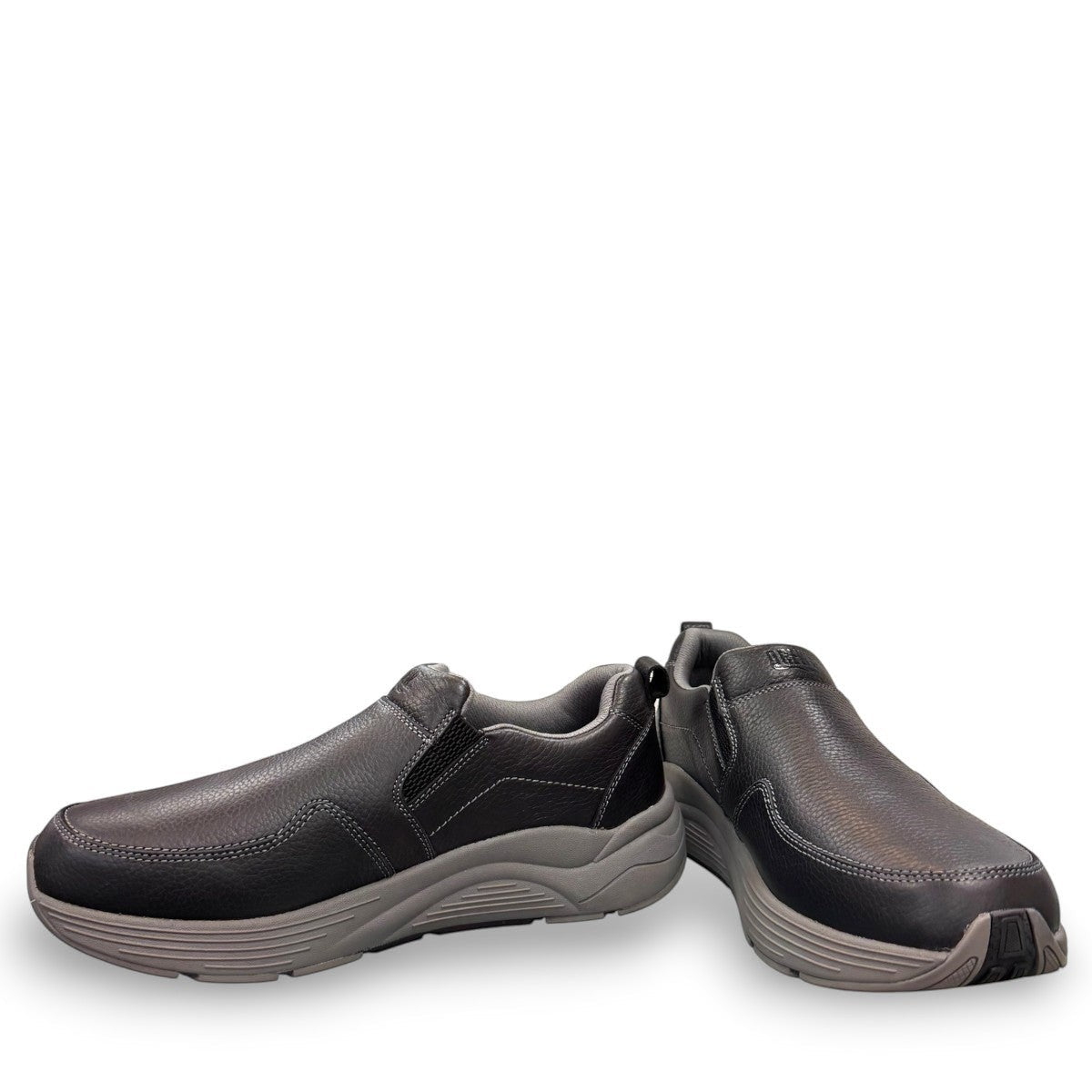 Drew Match black pebbled leather slip-on shoe showing the textured rubber rocker bottom outsole