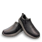 Drew Match black pebbled leather slip-on shoe showing the textured rubber rocker bottom outsole