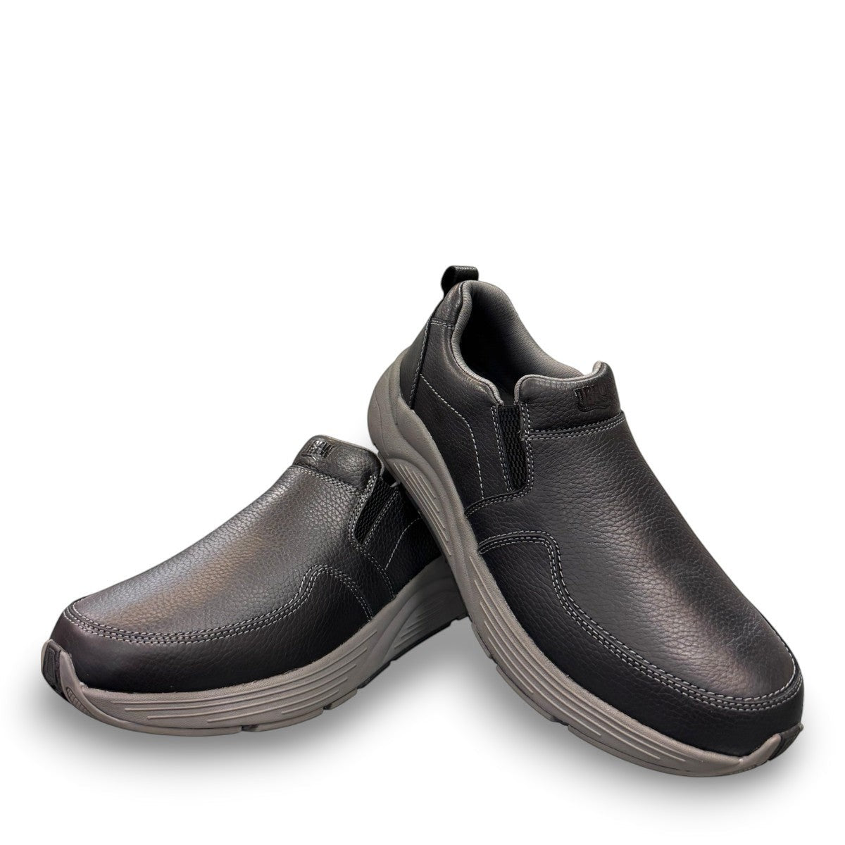 Drew Match black pebbled leather slip-on shoe showing the textured rubber rocker bottom outsole
