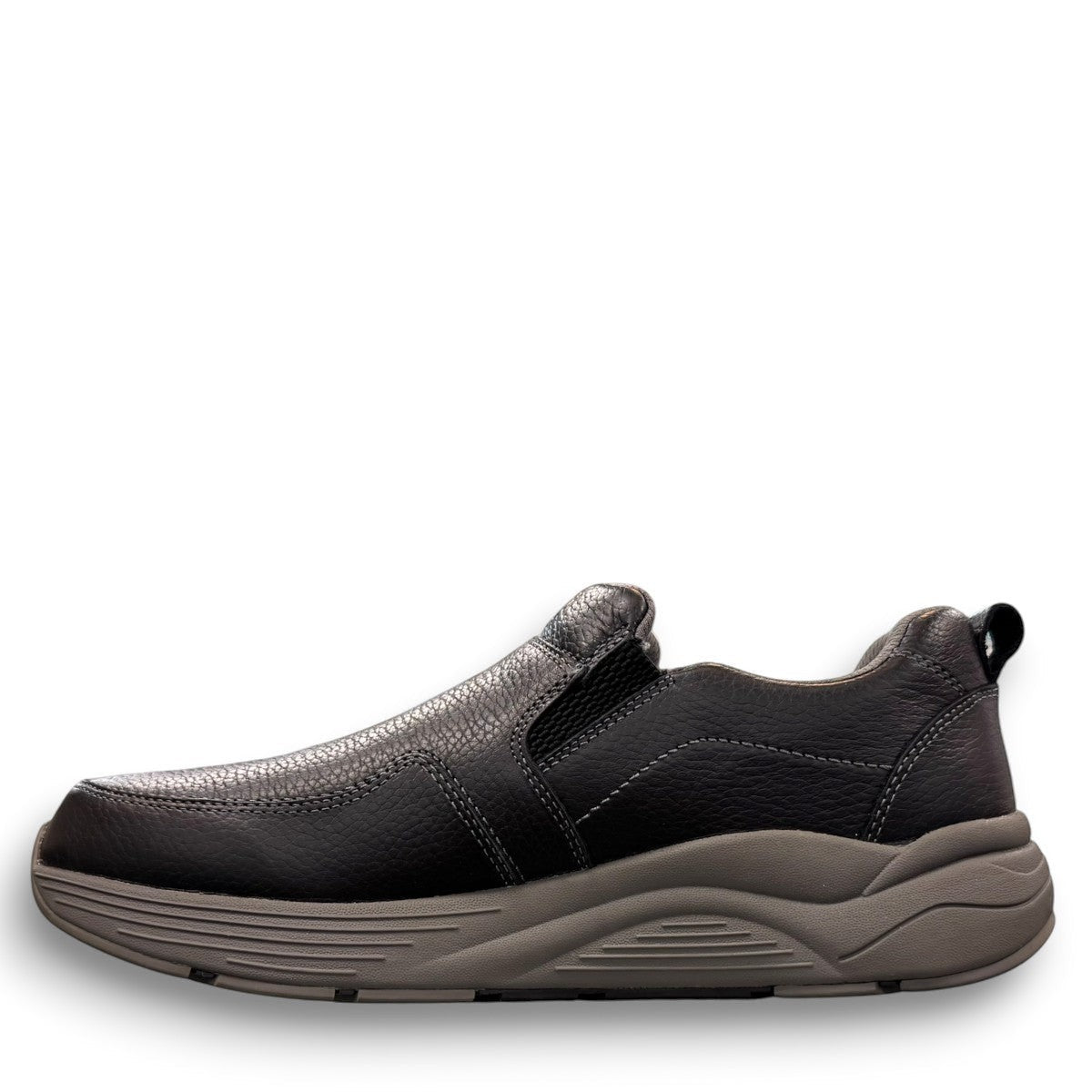 Drew Match black pebbled leather slip-on shoe showing the textured rubber rocker bottom outsole