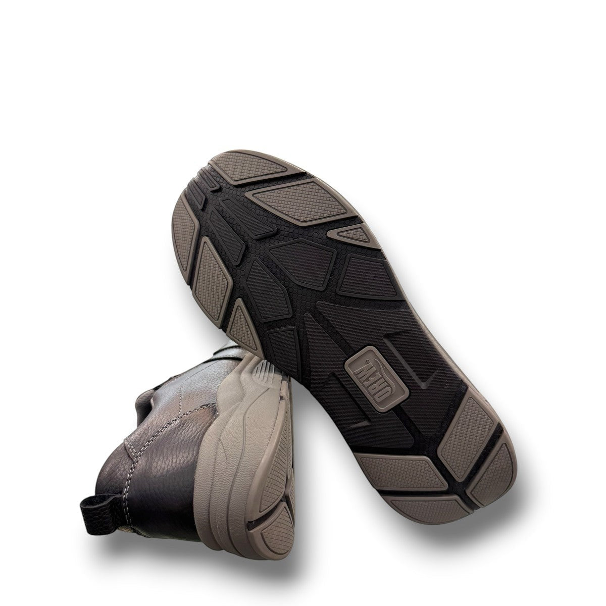 Drew Match black pebbled leather slip-on shoe showing the textured rubber rocker bottom outsole