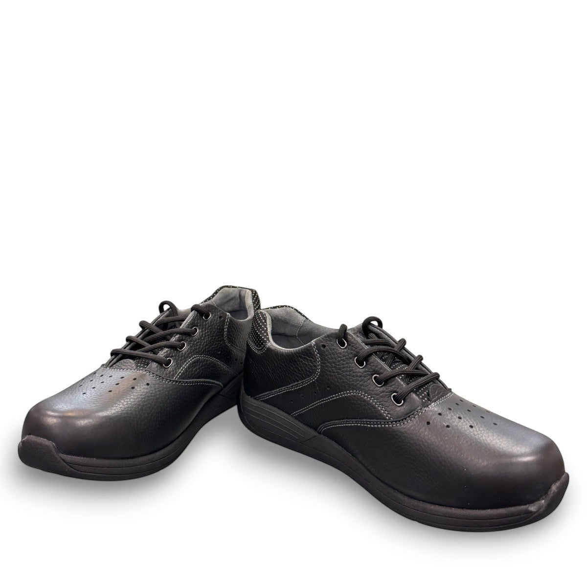 Drew Tour black leather oxford shoe showing the textured slip-resistant polyurethane outsole. orthopedic shoe