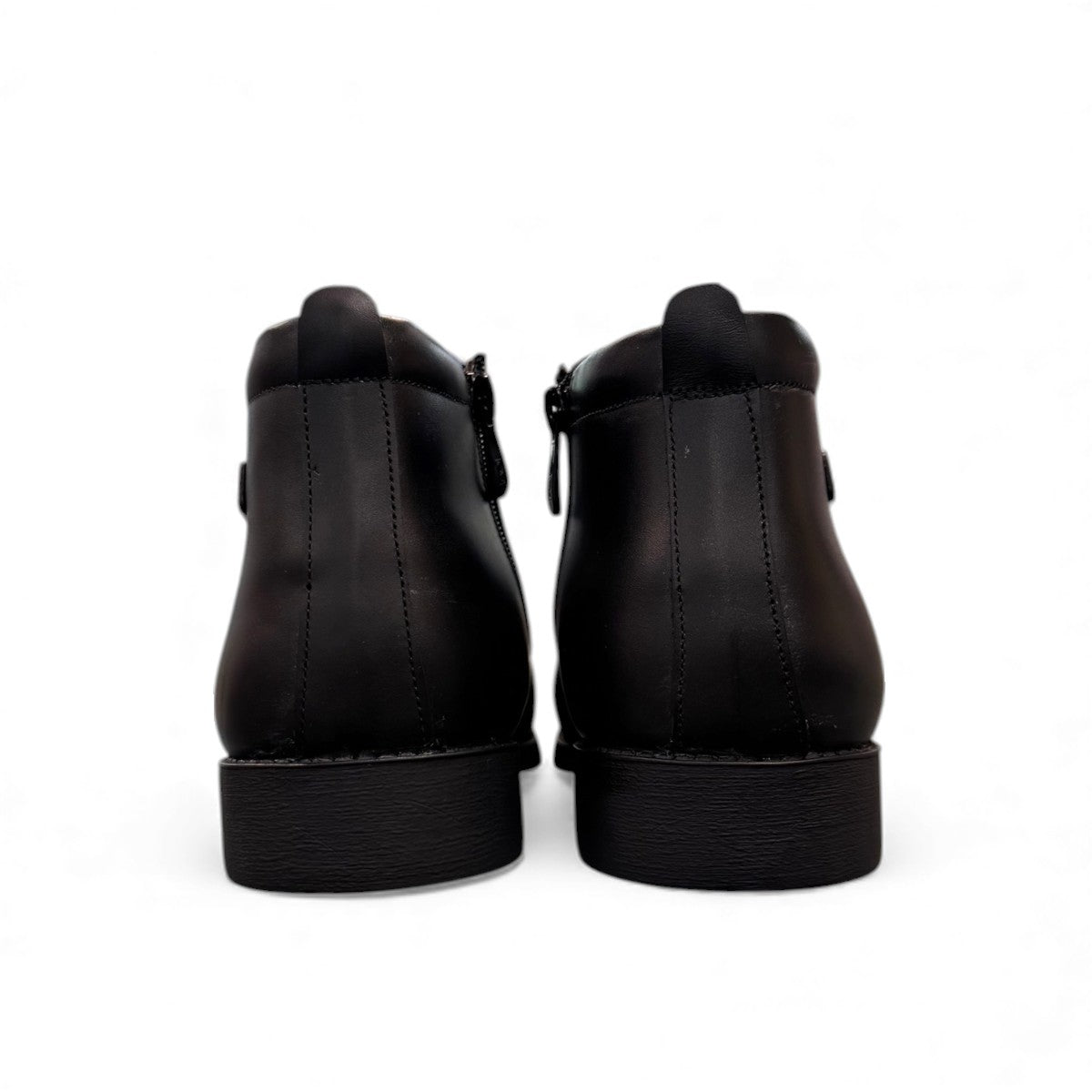 Exon Caspian black leather ankle boots for men with a rubber outsole and side zipper detail. Photo of back view.
