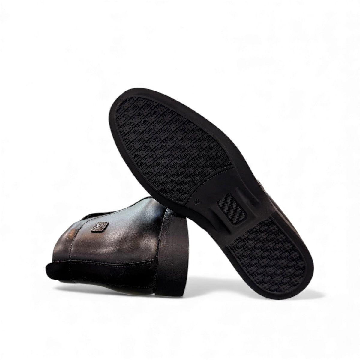 Exon Caspian black leather ankle boots for men with a rubber outsole and side zipper detail. Photo of bottom view.