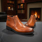 Exon Caspian light brown leather ankle boots with a rubber outsole and side detail. Photo of front side view 1.