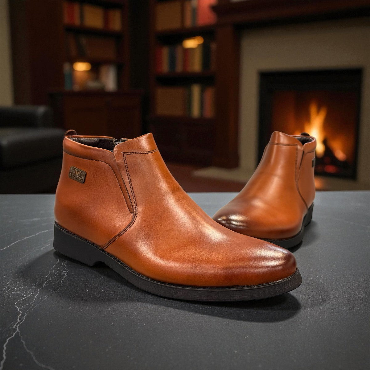 Exon Caspian light brown leather ankle boots with a rubber outsole and side detail. Photo of front side view 1.