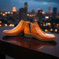 Exon Caspian light brown leather ankle boots with a rubber outsole and side detail. Photo of front side view 2.