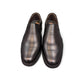 EXON ISFAHAN black leather slip-on men's shoes with rubber outsole and side logo detail. Photo of front view.