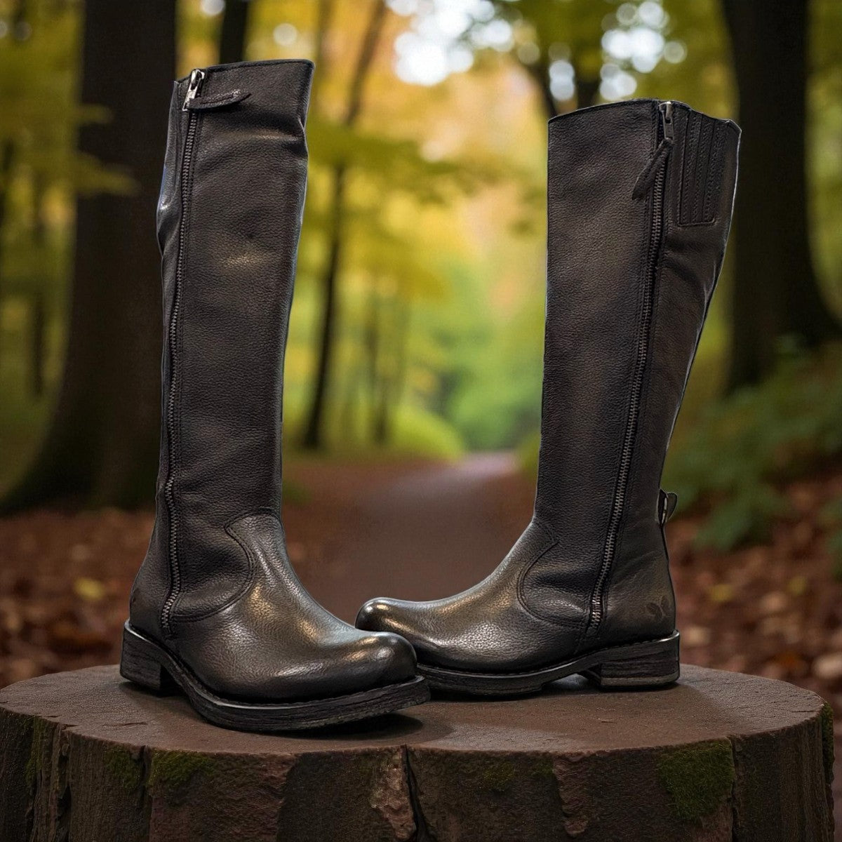Felmini D624 black leather knee-high boots with side zipper, elastic gore, and burnished toe detail. Photo of front side view 1.