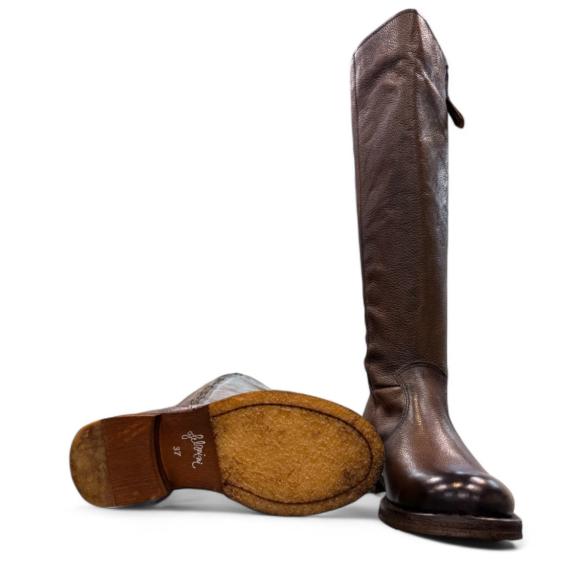 Felmini D624 brown leather knee-high boots with side zipper, elastic gore, and burnished toe detail. Photo of bottom view.