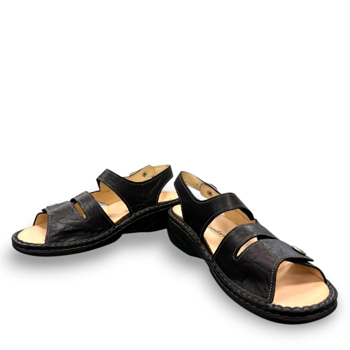 Finn Comfort Gomera black leather sandal with adjustable hook and loop straps and cork footbed.
photo of the front side