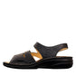 Finn Comfort Gomera black leather sandal with adjustable hook and loop straps and cork footbed.
photo of the left side