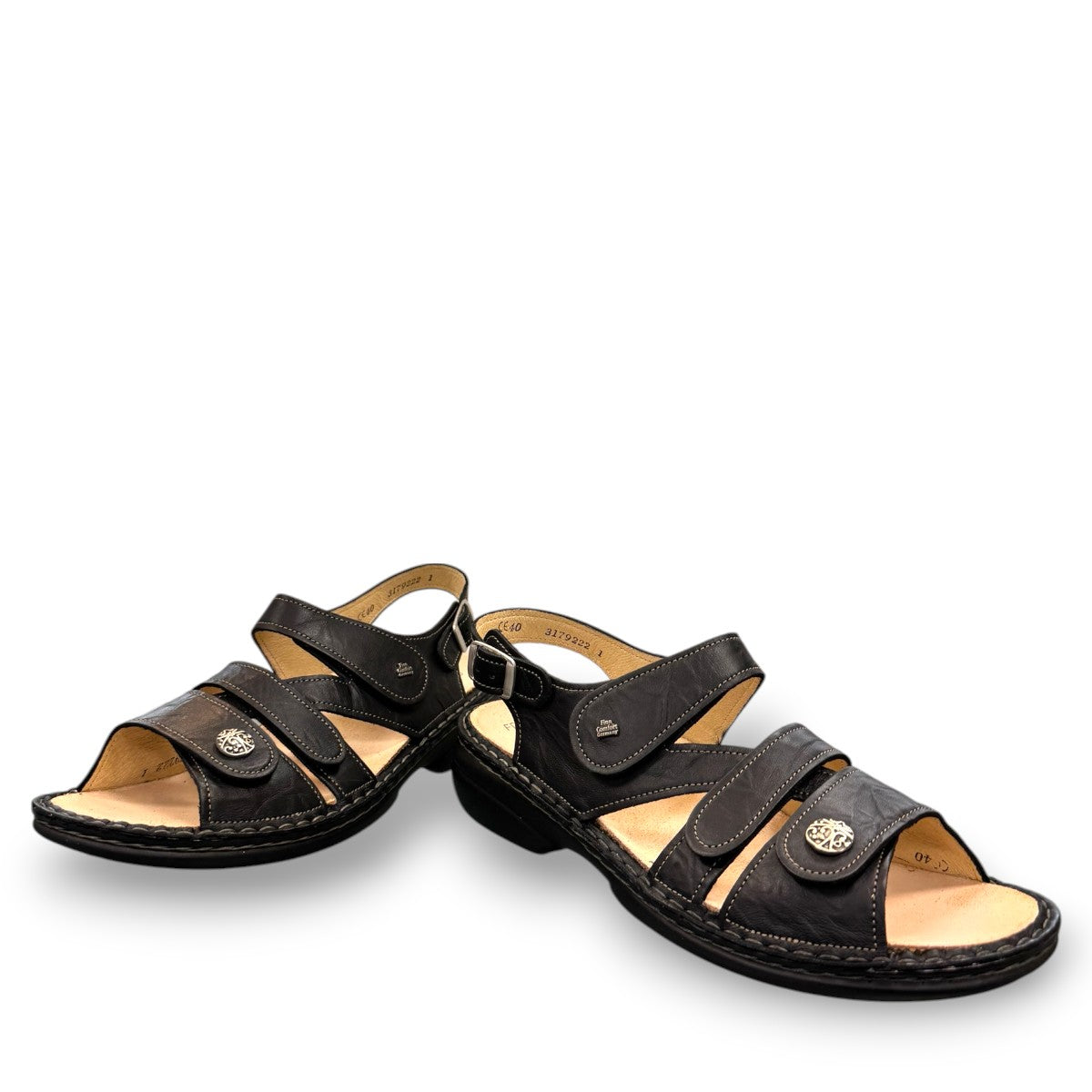Finn Comfort Gomera black leather sandal with adjustable hook and loop straps and cork footbed.
photo of the front side