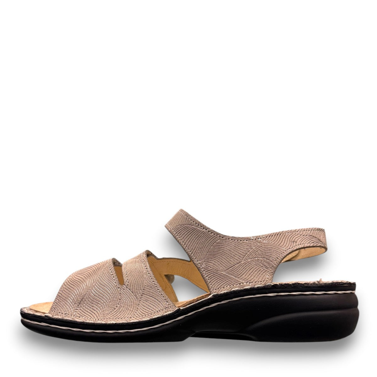 Finn Comfort Gomera sandal in storm sand leather with adjustable straps and cork footbed.
photo of the left side