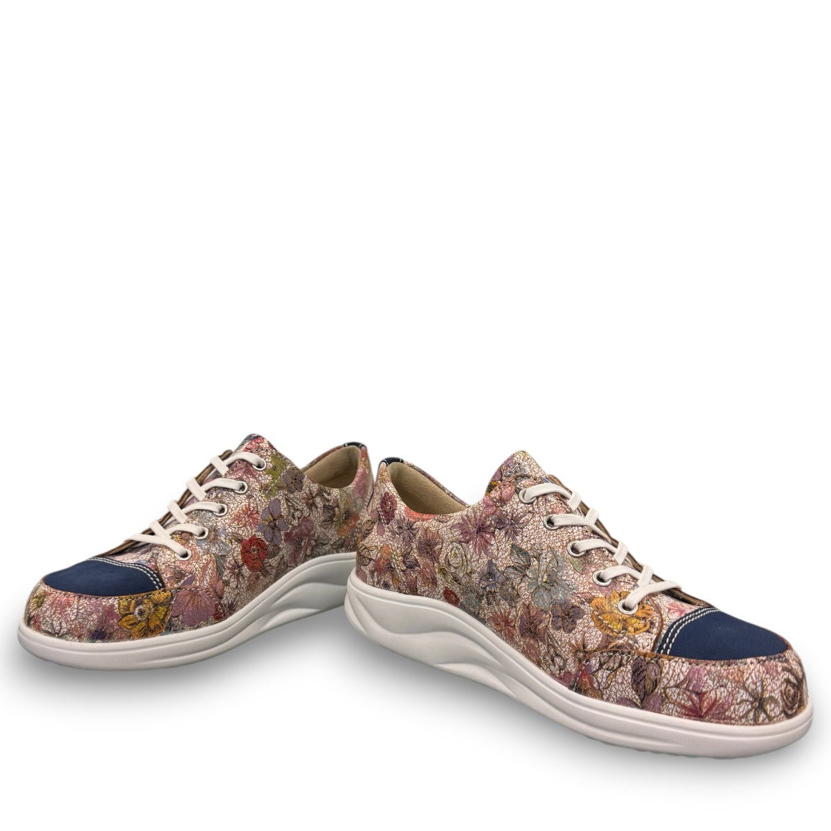 Finn Comfort Ikebukuro sneaker in multi-colored floral nubuck leather with a curved Finnamic outsole.
photo of the front side