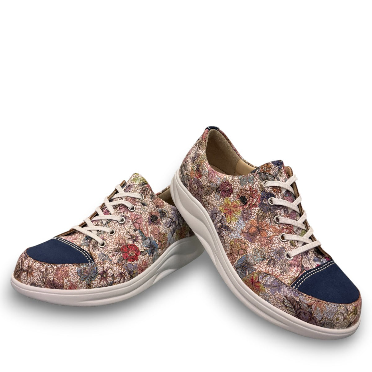 Finn Comfort Ikebukuro sneaker in multi-colored floral nubuck leather with a curved Finnamic outsole.
photo of the front side