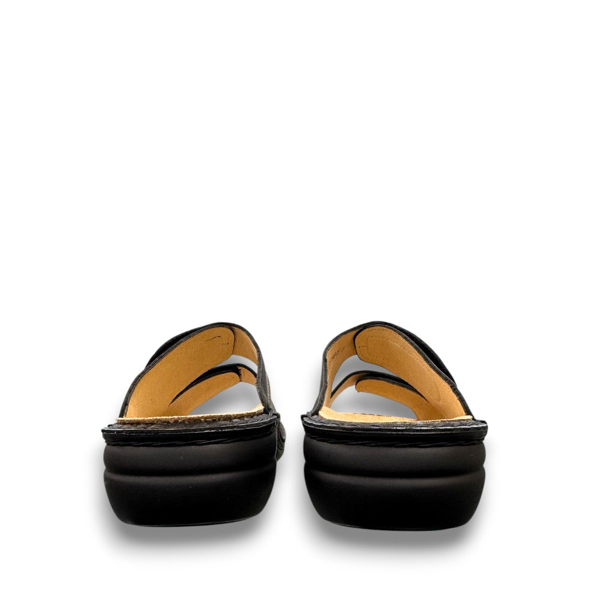 Finn Comfort Sansibar black leather sandal with two adjustable straps and decorative silver button.
photo of the back side