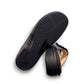 Finn Comfort Sansibar black leather sandal with two adjustable straps and decorative silver button.
photo of the bottom side