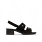 black leather slingback sandals with glossy stud details and a comfortable block heel.