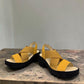 Fly London Taji502fly cupido bumblebee yellow elastic and leather platform sandals with a chunky lugged rubber sole.