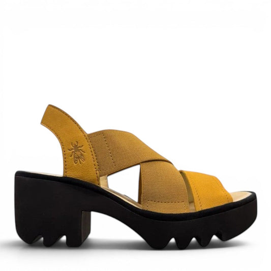 Fly London Taji502fly cupido bumblebee yellow elastic and leather platform sandals with a chunky lugged rubber sole.